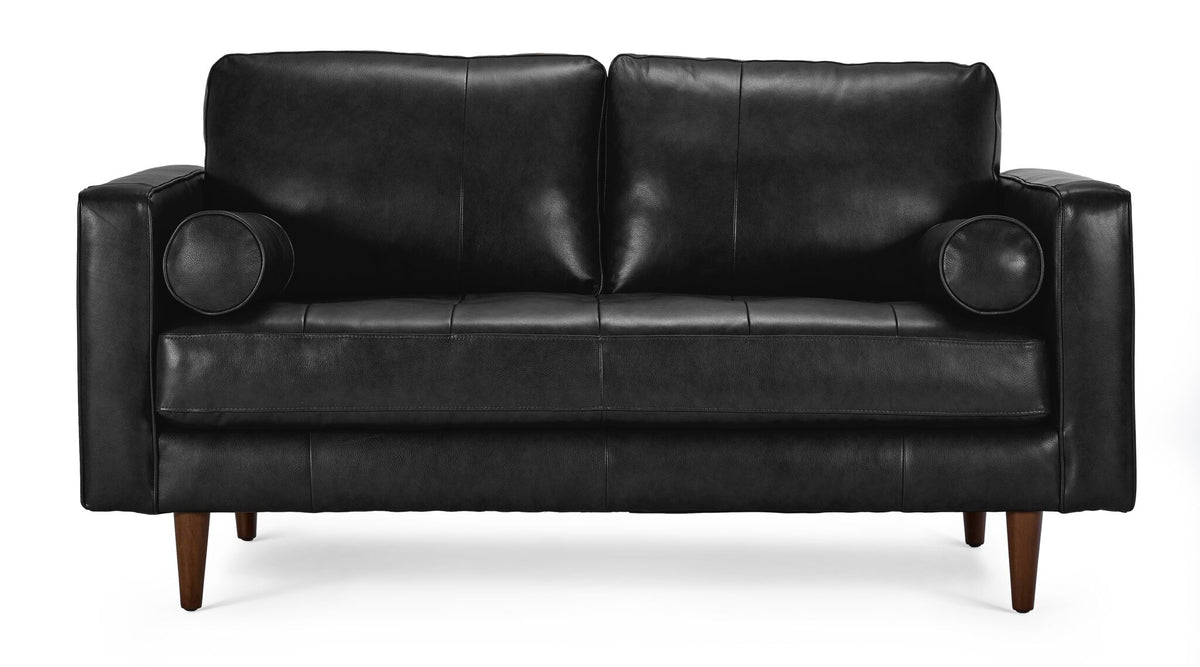 Front view of black Bari Leather Loveseat with deep cushioned seating and matching round bolster pillows.