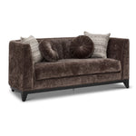 Tresor dark brown loveseat with curved back, button-tufted detail, accent pillows and angled front view