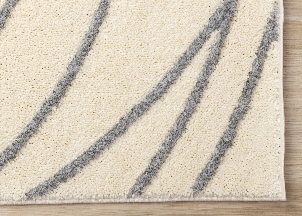 Sully 5'3" x 7'7" Circle Swirl Area Rug - Cream