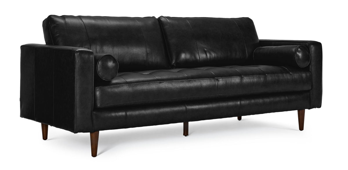 Bari Leather Sofa in black with tufted seating, plush back cushions, bolster pillows and tapered wood legs.
