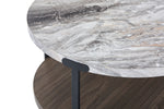Kosmos coffee table close-up showing grey faux marble top, black metal support and dark oak lower shelf