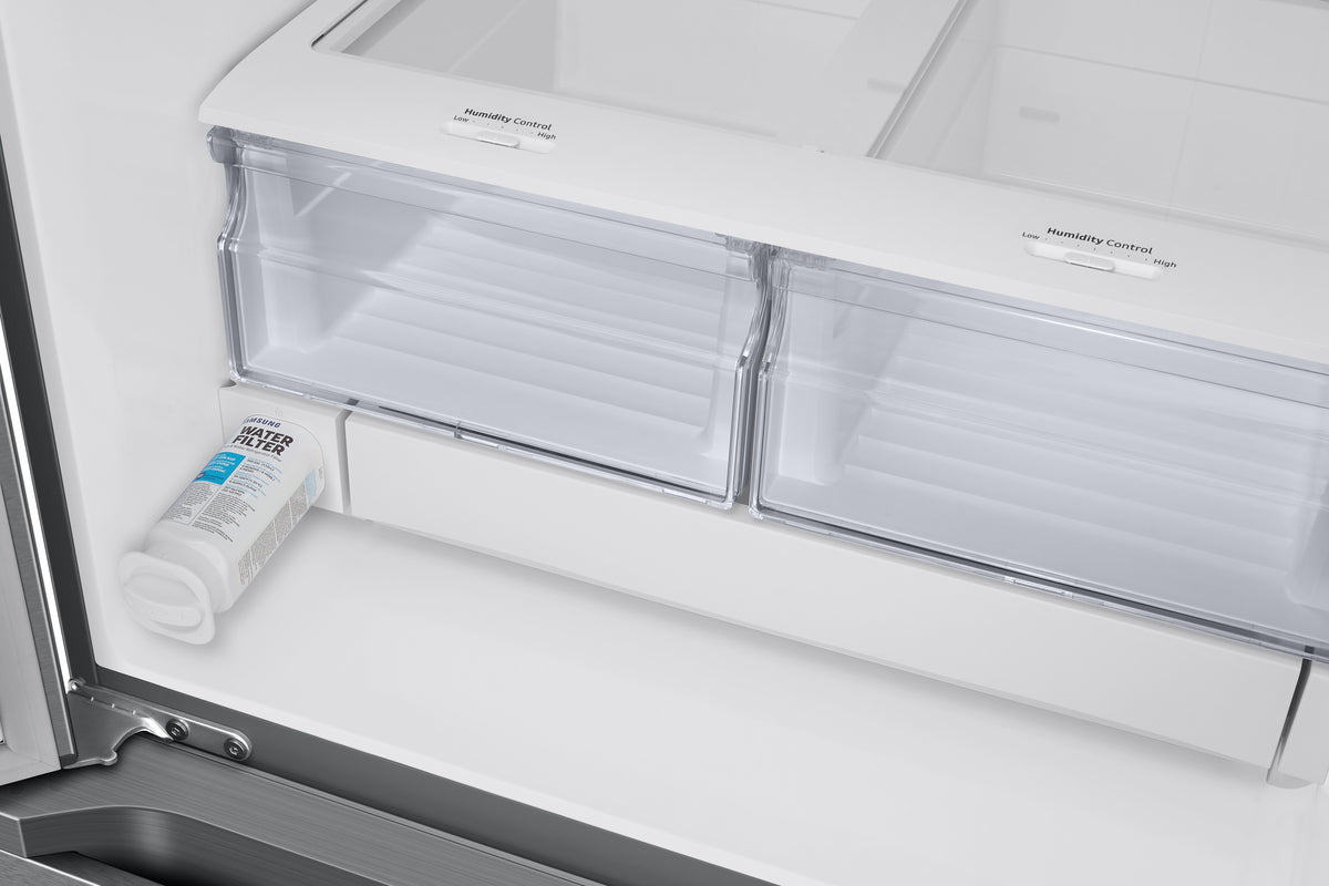 Samsung French door refrigerator interior showing humidity-controlled crispers and water filter